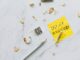 Overhead shot of a note saying 'Stop Burnout' on a marble surface with pencil shavings.